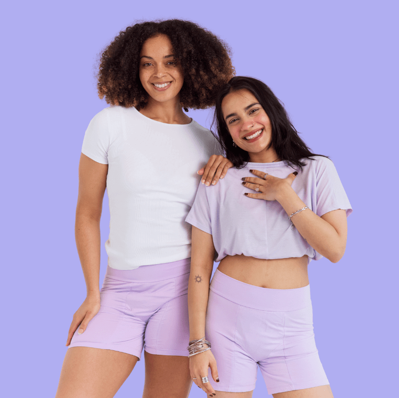 Endometriosis Kit - MightyEve  Two women standing together against a purple background wearing Mighty Eve Period Night Shorts