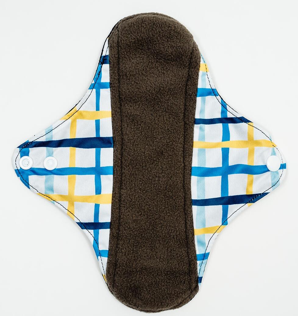 Mighty Medium Popper Pad - MightyEve Reusable menstrual popper pad with plaid pattern on a white background