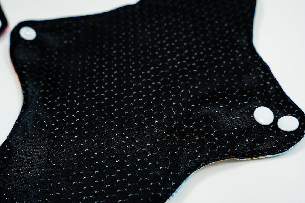 Mighty Heavy Night Popper Pad - MightyEve Black silicone non - slip fabric with white buttons on a white background