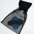 New Membership Offer - MightyEve  Black mesh bag with a blue item inside on a white background