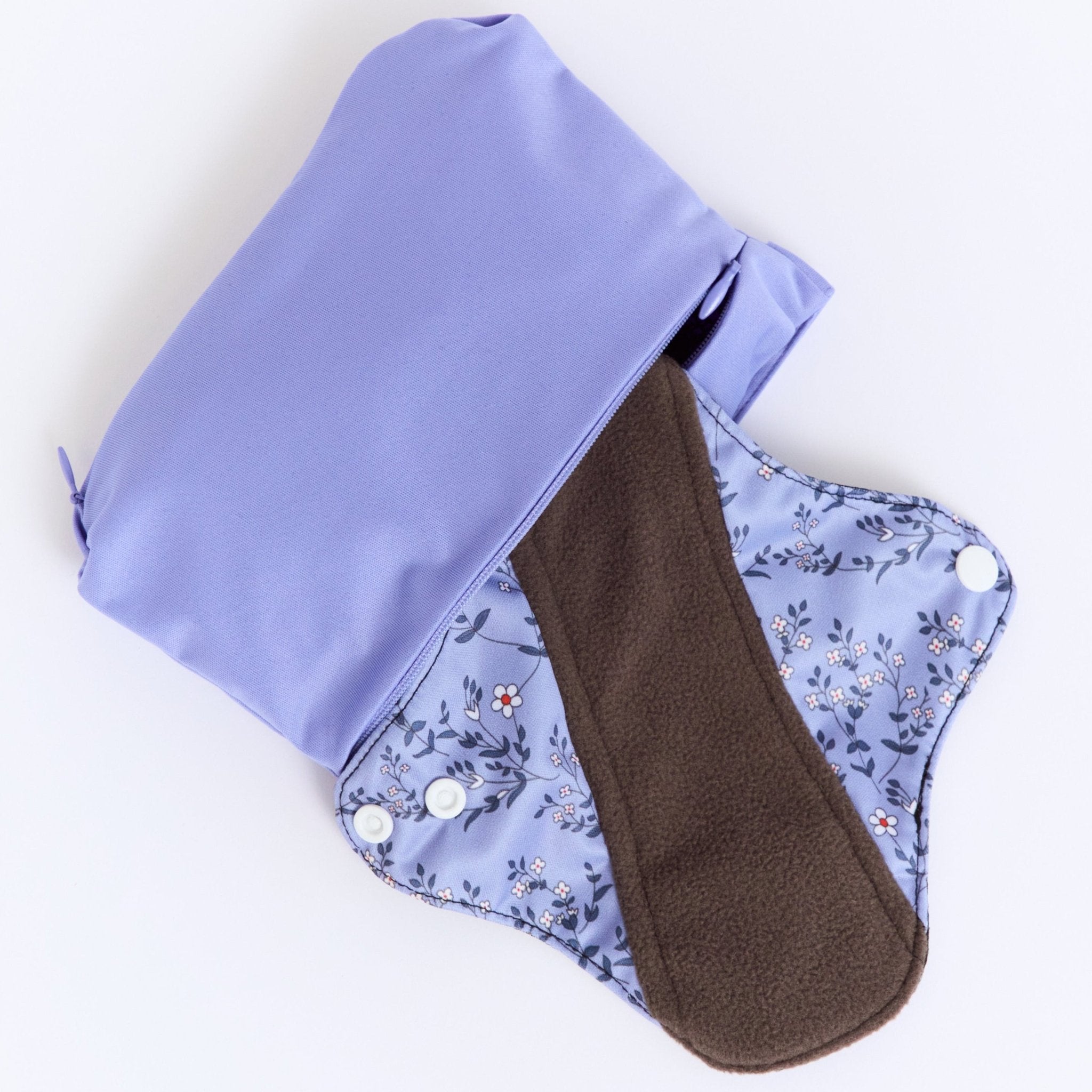 Mighty Heavy Night Popper Pad - MightyEve PPXL02P Reusable menstrual pad with a floral pattern and a brown interior, placed inside a matching wash clutch bag on a white background.