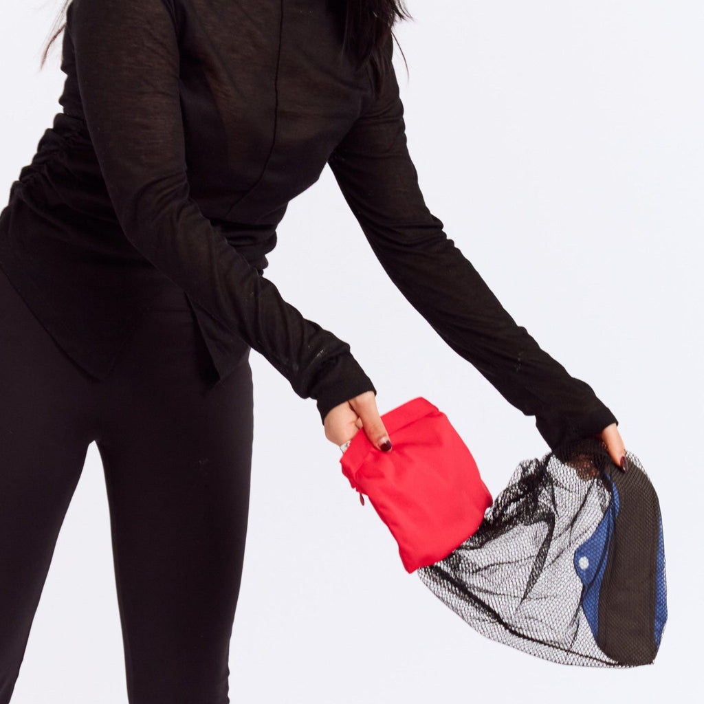 New Membership Offer - MightyEve  Person wearing a black outfit about to wash the clutch bag