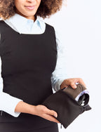 New Membership Offer - MightyEve  Person holding a black wash clutch bag with a white background